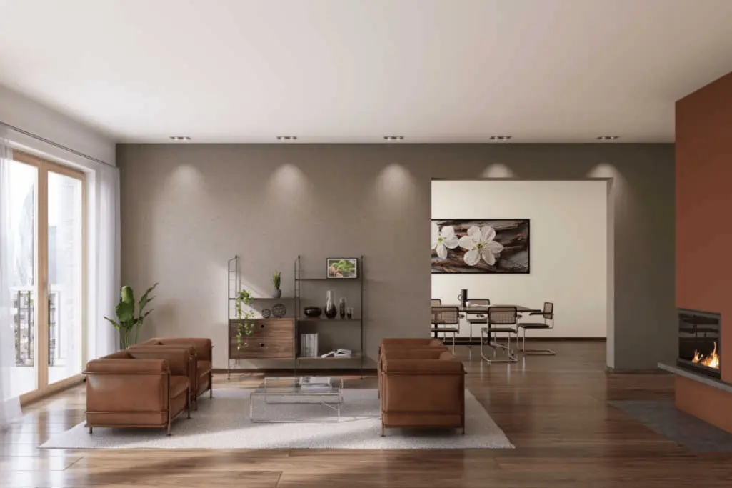 Wohnzimmer mit grauer StoColor Interior Colors 24+ Akzentwand.