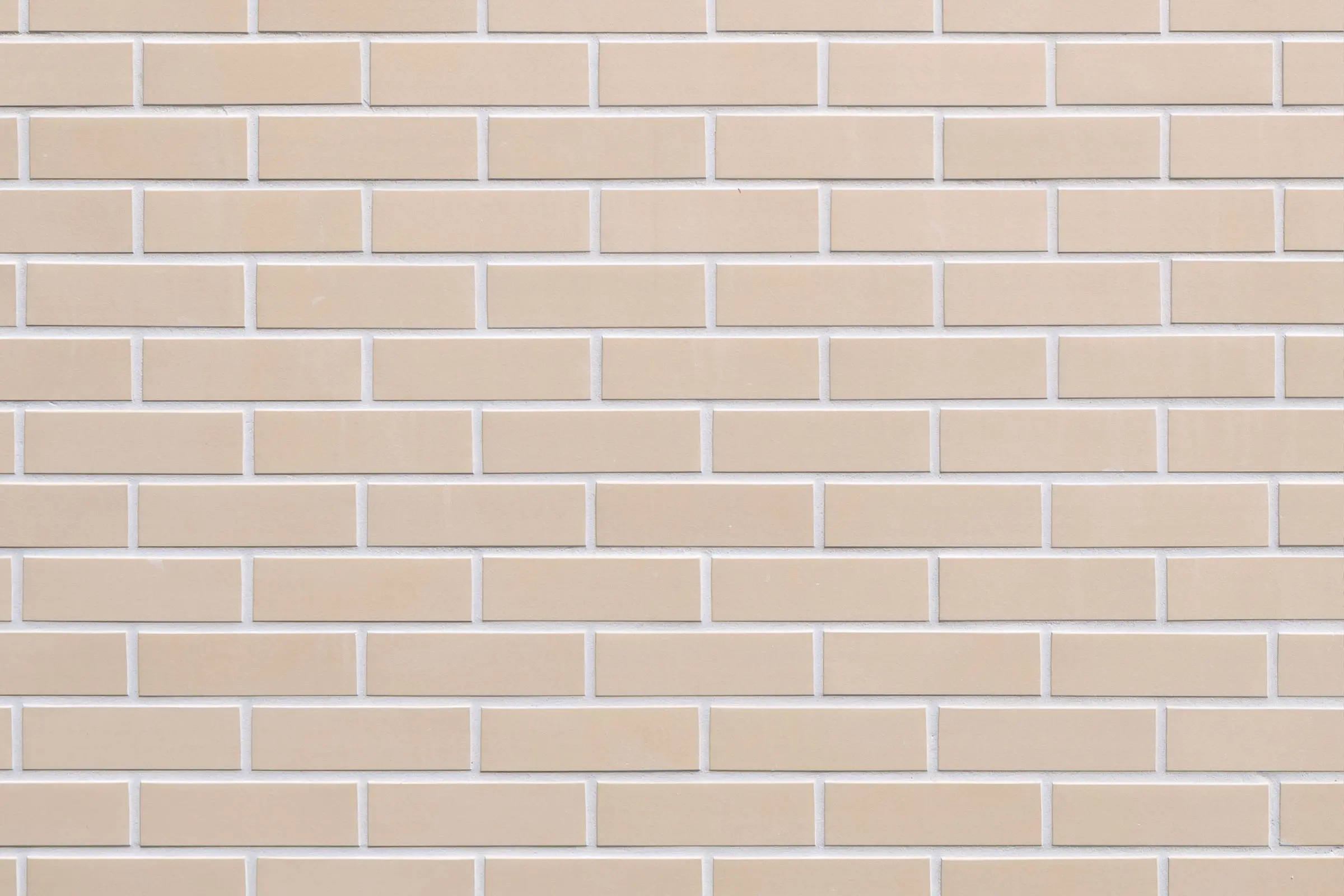 Digitale Nahaufnahme der Fassadenbekleidung StoBrick Klinker, hell-beige Ziegel